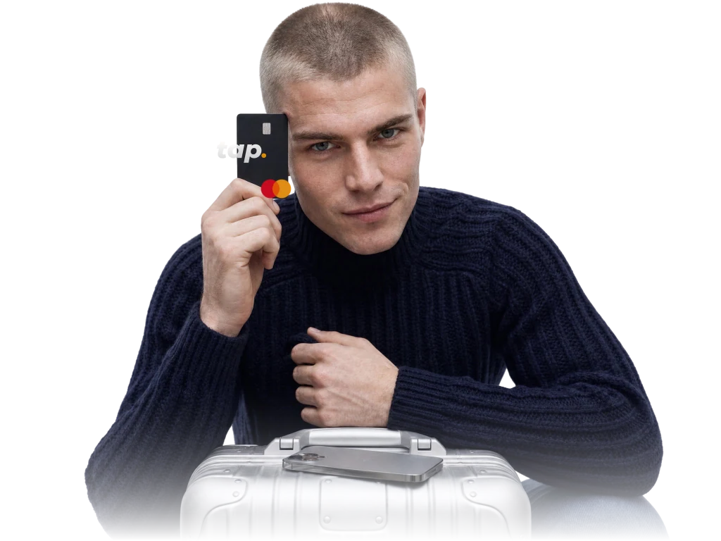Traveler with a Tap card and suitcase, ready for multi-currency travel